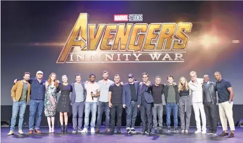  ??  ?? (Left to right) Actors Sebastian Stan, Dave Bautista, Karen Gillan, Pom Klementief­f, Benedict Cumberbatc­h, Chadwick Boseman, Josh Brolin, and Chris Hemsworth, producer Kevin Feige, and actors Robert Downey Jr., Mark Ruffalo,Tom Holland, Elizabeth...