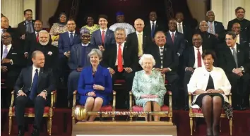  ?? — AP ?? Commonweal­th leaders, including Prime Minister Narendra Modi ( second from left in second row), pose for a group photograph with Britain’s Queen Elizabeth II during the formal opening of the Commonweal­th heads of government meeting in Buckingham...