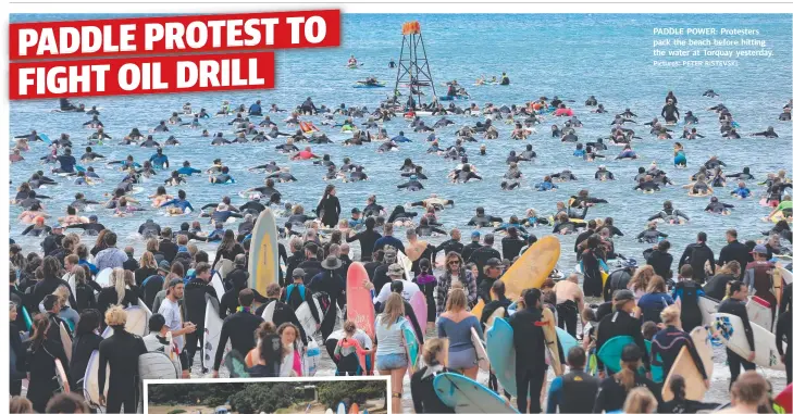  ?? Pictures: PETER RISTEVSKI ?? PADDLE POWER: Protesters pack the beach before hitting the water at Torquay yesterday.