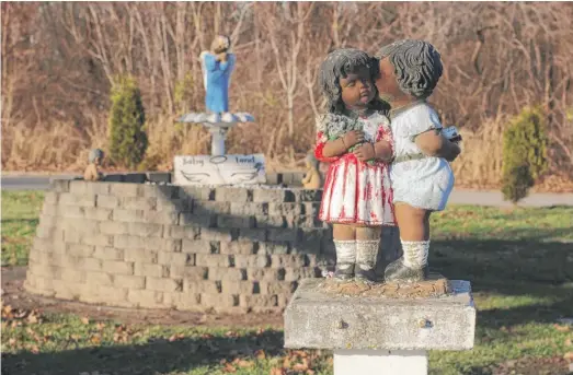  ?? CARA ANTHONY/KHN ?? More than 30 years ago, Johnnie Haire, the grounds supervisor at Sunset Gardens of Memory cemetery in downstate Millstadt, set up a birdbath and purchased angel figurines for a special area of the cemetery for deceased children, called Baby Land. He carefully painted each angel a hue of brown. He says he wanted the angels to be Black, like many of the children laid to rest there.