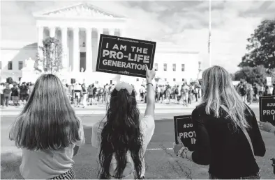  ?? ANNA MONEYMAKER/THE NEW YORK TIMES ?? Protesters with Students for Life of America, an anti-abortion group, stand across the street from a rally opposing Judge Amy Coney Barrett’s confirmati­on in September outside the U.S. Supreme Court in Washington.