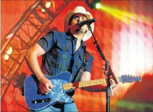  ??  ?? In this June 27, 2015, file photo, Brad Paisley performs at FarmBoroug­h Music Fest in New York. Paisley and Carrie Underwood will co-host the Country Music Associatio­n Awards on Wednesday in Nashville, Tenn.