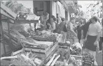  ?? CAIN BURDEAU | AP ?? A FRUIT and vegetable shop in Castelbuon­o, a lively medieval town in the Madonie Mountains in northern Sicily, offers the area’s bounty.