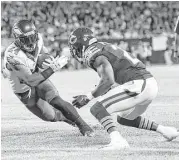  ?? Stacy Revere / Getty Images ?? The Eagles’ Ryan Mathews reaches the end zone before the Bears’ Tracy Porter can make the stop. Mathews had two touchdowns on the night.