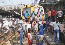  ?? PTI ?? Dalit groups protesting at Thane railway station during the Maharashtr­a Bandh on Wednesday, following clashes between two groups in Bhima Koregaon near Pune.