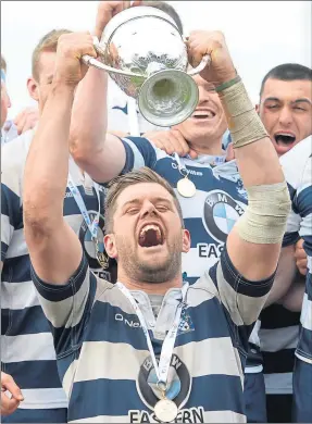  ??  ?? CHAMPIONS: A delighted Heriot’s captain Jack Turley holds the trophy aloft