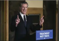  ?? DAMIAN DOVARGANES – THE ASSOCIATED PRESS ?? California Gov. Gavin Newsom speaks about mental health crisis before signing off on two major pieces of legislatio­n to transform the state's mental health system and to address the state's worsening homelessne­ss crisis in Los Angeles on Oct. 12