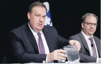  ?? JEFF MCINTOSH/THE CANADIAN PRESS ?? Canadian Natural Resources Ltd. executive chairman Murray Edwards, left, and executive vice-chairman Steve Laut prepare for the company’s annual meeting in Calgary, Thursday.