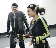  ?? Christina House Los Angeles Times ?? VIDEO game performanc­e is a passion of Julia Blanco Schoeff ling’s. Above, actor Anjali Bhimani gives Todd Martens a motioncapt­ure demo.