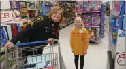  ?? FRAN MAYE - MEDIANEWS GROUP ?? Sophiarose Wright goes shopping at the East Marlboroug­h Walmart Saturday during the annual Shop With the Sheriff program.