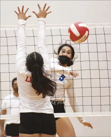  ?? The Maui News / MATTHEW THAYER photos ?? Baldwin High School’s Amanda Naipo directs a kill past the block of Lahainalun­a’s Jazmin Mathias during the first set of the Bears’ 25-15, 25-16, 25-19 win over the Lunas on Thursday night.