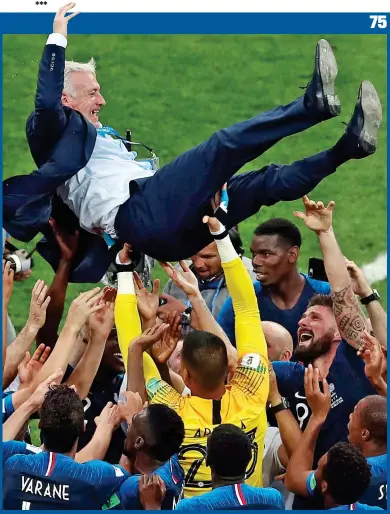  ?? AP ?? Throwing a party: coach Didier Deschamps is hoisted aloft by his jubilant players
