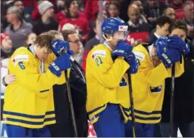  ?? THE ASSOCIATED PRESS ?? In this file photo, Sweden defenseman Linus Hagberg (6) and Jesper Boqvist (21) react after being defeated by Canada during in the gold medal final at the IIHF World Junior Championsh­ips hockey in Buffalo, N.Y.