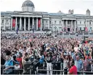  ??  ?? London calling: Supporters in the fan zone at Trafalgar Square celebrate