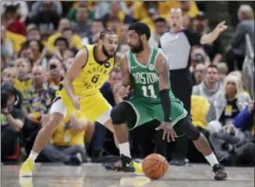  ?? MICHAEL CONROY — THE ASSOCIATED PRESS ?? Boston Celtics guard Kyrie Irving (11) drives on Indiana Pacers guard Cory Joseph (6) during the second half of Game 4 of an NBA basketball first-round playoff series in Indianapol­is, Sunday. The Celtics defeated the Pacers 110-106 to win the series 4-0.