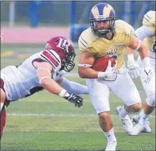  ?? MEDIANEWS GROUP FILE ?? Adam Dempsey, right, in action during his collegiate career at West Chester, sprinted 80 yards on the first play from scrimmage 10 years ago to pace Cardinal O’Hara to a 20-0 victory over Archbishop Ryan in the Battle at the Beach in Ocean City, N.J.