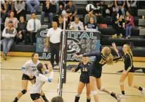  ?? LUKE E. MONTAVON/THE NEW MEXICAN ?? Santa Fe High’s Jorja Chambers, front right, spikes during Game 2 of Tuesday’s match against the Jaguars at Capital High.