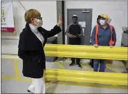  ??  ?? Claire Babineaux-Fontenot, CEO of Feeding America, talks with volunteers in the warehouse at Helping Harvest in Spring Township. Helping Harvest is a member of Feeding America.