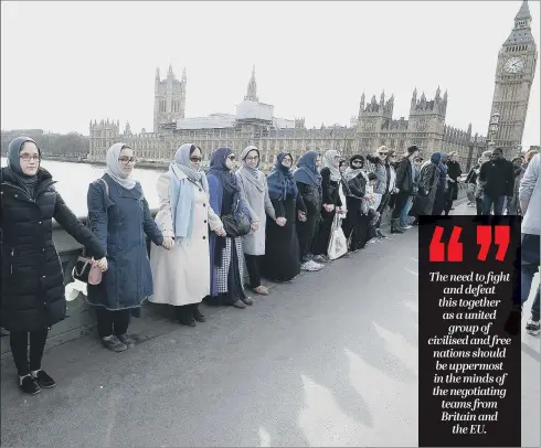  ?? PICTURE: PA ?? SOLIDARITY: A group of British women, many of them Muslims, join hands across Westminste­r Bridge to show support for the victims of last week’s terror attack.