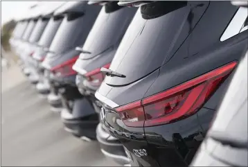  ?? DAVID ZALUBOWSKI — THE ASSOCIATED PRESS ?? A long row of unsold 2021 QX50 sports-utility vehicles sits at an Infiniti dealership in Highlands Ranch, Colo., on Dec. 27.