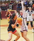  ?? Randy Moll/Westside Eagle Observer ?? Gravette junior Brynn Romine looks to put up a shot while guarded by Gentry junior Kaitlyn Caswell on Friday at Gentry High School.