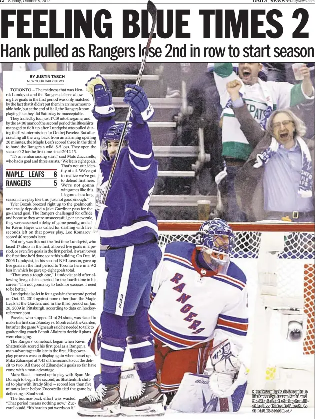  ??  ?? Henrik Lundqvist is brought to his knees by Nazem Kadri and the Maple Leafs during humiliatin­g loss that puts Blueshirts at 0-2 this season. AP