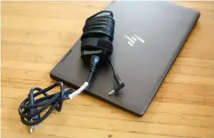  ??  ?? A 65-watt barrel charger definitely tells you this isn’t a luxury laptop.