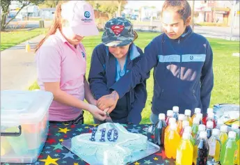  ??  ?? CAKE cutting with a girl from each town: Pahiatua, Dannevirke and Woodville.