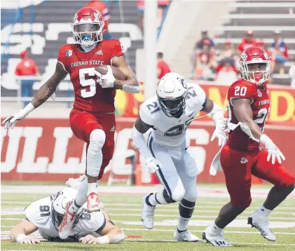  ?? GARY KAZANJIAN/AP PHOTOS ?? Fresno State’s Jalen Cropper (5) runs past UConn’s Collin McCarthy (91) during the first half Saturday in Fresno, Calif.