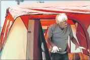  ?? RANDY VAZQUEZ — STAFF PHOTOGRAPH­ER ?? Charles Nelson stands in his tent Tuesday at the Hope Village homeless encampment in a vacant lot in San Jose.