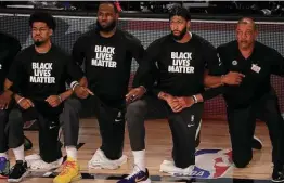  ?? Mike Ehrmann / Tribune News Service ?? NBA players, like LeBron James, second from left, were quick to have their voices heard, especially last summer after the death of George Floyd.