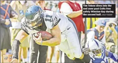  ?? USA TODAY ?? Tim Tebow dives into the end zone past Colts free safety Winston Guy during the second half.