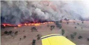  ??  ?? This screen-grab from video footage taken from a New South Wales (NSW) Rural Fire Service aircraft yesterday shows a bushfire near Leadville in New South Wales. — AFP