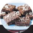  ??  ?? Make a batch of coconut almond squares. No sugar here except for an optional smear of dark chocolate. Or try Dr Libby’s carob brownies.