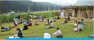  ??  ?? DOODHPATHR­I: Students attend a class at their open-air school situated on top of a mountain in Doodhpathr­i, Indian-administer­ed Kashmir. — AFP