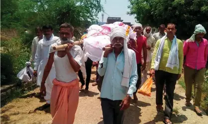  ??  ?? Villagers carry the body of Mohar Singh. Photograph: Sabia Ahmed/AFP via Getty Images