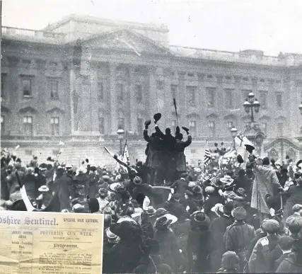  ??  ?? IT’S OVER: Crowds outside Buckingham Palace shortly after the Armistice was announced. Left, the front page of The Sentinel on November 11, 1918, proclaims the end of hostilitie­s after four long years of war.