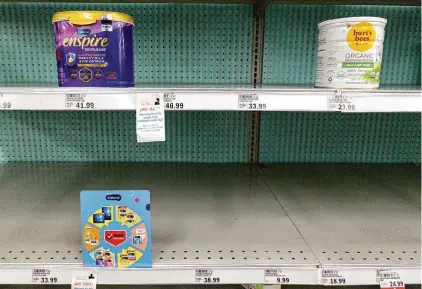  ?? Michael Conroy/Associated Press 2022 ?? Nearly empty baby formula shelves in Carmel, Ind., in May 2022. Closure of one factory caused a nationwide shortage.