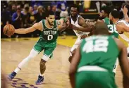  ?? Scott Strazzante / The Chronicle ?? The Celtics’ Jayson Tatum didn’t shoot well (3-for-17) in Game 1, but he did have 13 assists.