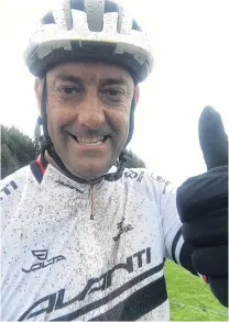  ?? PHOTO: SUPPLIED ?? So far, so good . . . Scott Weatherall takes a quick break while out on a bike training ride as he prepares for Ironman New Zealand.