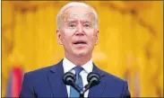  ??  ?? President Joe Biden speaks during an event to mark Internatio­nal Women’s Day on Monday in the East Room of the White House in Washington. Biden laid out an ambitious agenda for his first 100 days in office, promising swift action on everything from climate change to immigratio­n reform to the coronaviru­s pandemic. [PATRICK SEMANSKY/ THE ASSOCIATED PRESS]