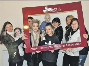  ??  ?? ACHA’s new tenants on Sunderland Drive, including Lucy Williams and Maisie, far left.