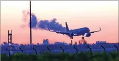  ?? J’RG CARSTENSEN / DPA VIA AP ?? An Air Force Airbus carrying German citizens evacuated from Sudan lands at Berlin Brandenbur­g Airport in Schonefeld, Germany on Monday.