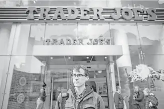  ?? Joshua Bright / New York Times ?? Thomas Nagle is outside the Trader Joe’s in New York where he was fired. Employees of the grocery chain are complainin­g of harsh treatment by managers and a pressure to appear happy.