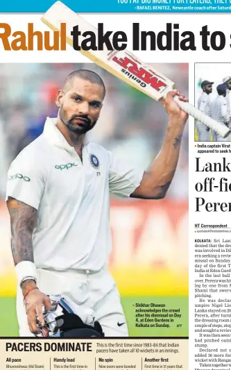  ?? AFP ?? Shikhar Dhawan acknowledg­es the crowd after his dismissal on Day 4, at Eden Gardens in Kolkata on Sunday. India captain Virat Kohli (R) was irked after Dilruwan Perera appeared to seek help from the dressing room on Sunday.