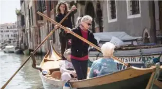  ??  ?? The Row Venice organizati­on is a group of women who teach tourists how to row Venetian style, standing up. — AFP photos