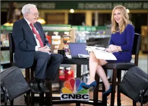  ?? Omaha World-Herald/RYAN SODERLIN ?? Warren Buffett, in an interview with CNBC’s Becky Quick, said Monday that Berkshire Hathaway is heavily invested in Apple because the iPhone maker has a “sticky product” that has proved indispensa­ble for many consumers.