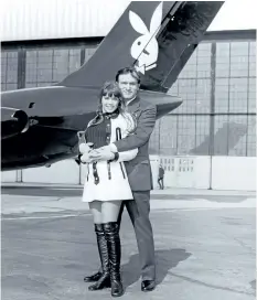  ?? WENN ?? Barbi Benton and Hugh Hefner in front of the iconic Playboy jet in the 1970s.