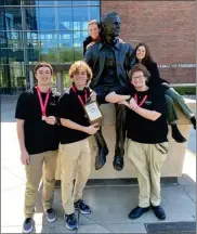  ?? PHOTO PROVIDED ?? The BHS Math Academic Team finished in second place in their class and sixth overall at the state competitio­n on May 7. Pictured here from left to right around the statue of Neil Armstrong at Purdue University: back row: Coach Kathy Cullers and Italian Exchange Student Giulia Zanola. Front row: Senior Ty Feldman, Junior Braden Unruh, and Junior Caleb Cullers.