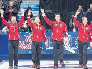  ?? CANADIAN PRESS PHOTO/ANDREW VAUGHAN ?? Members of Team Canada (from left), Brad Gushue, Mark Nichols, Brett Gallant and Geoff Walker acknowledg­e the fans in the stands after winning the 2018 Tim Hortons Brier Sunday in Regina. Gushue and his teammates on the St. John’s rink say they will...